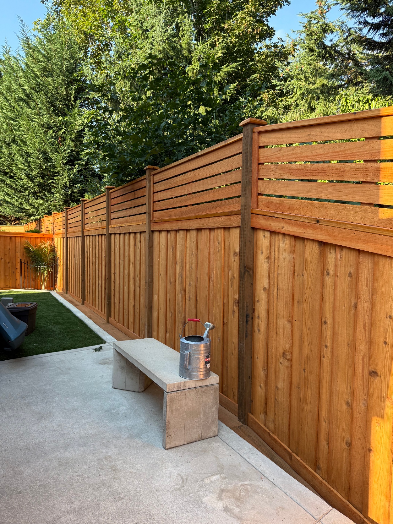 Modern horizontal lattice topper on cedar fence creating beautiful backyard privacy
