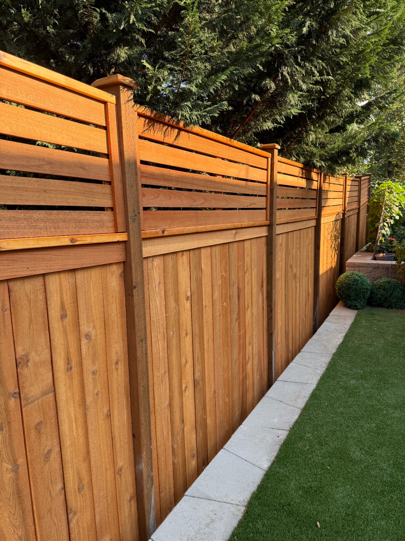 6-foot cedar fence with 2-foot horizontal lattice topper along residential property line