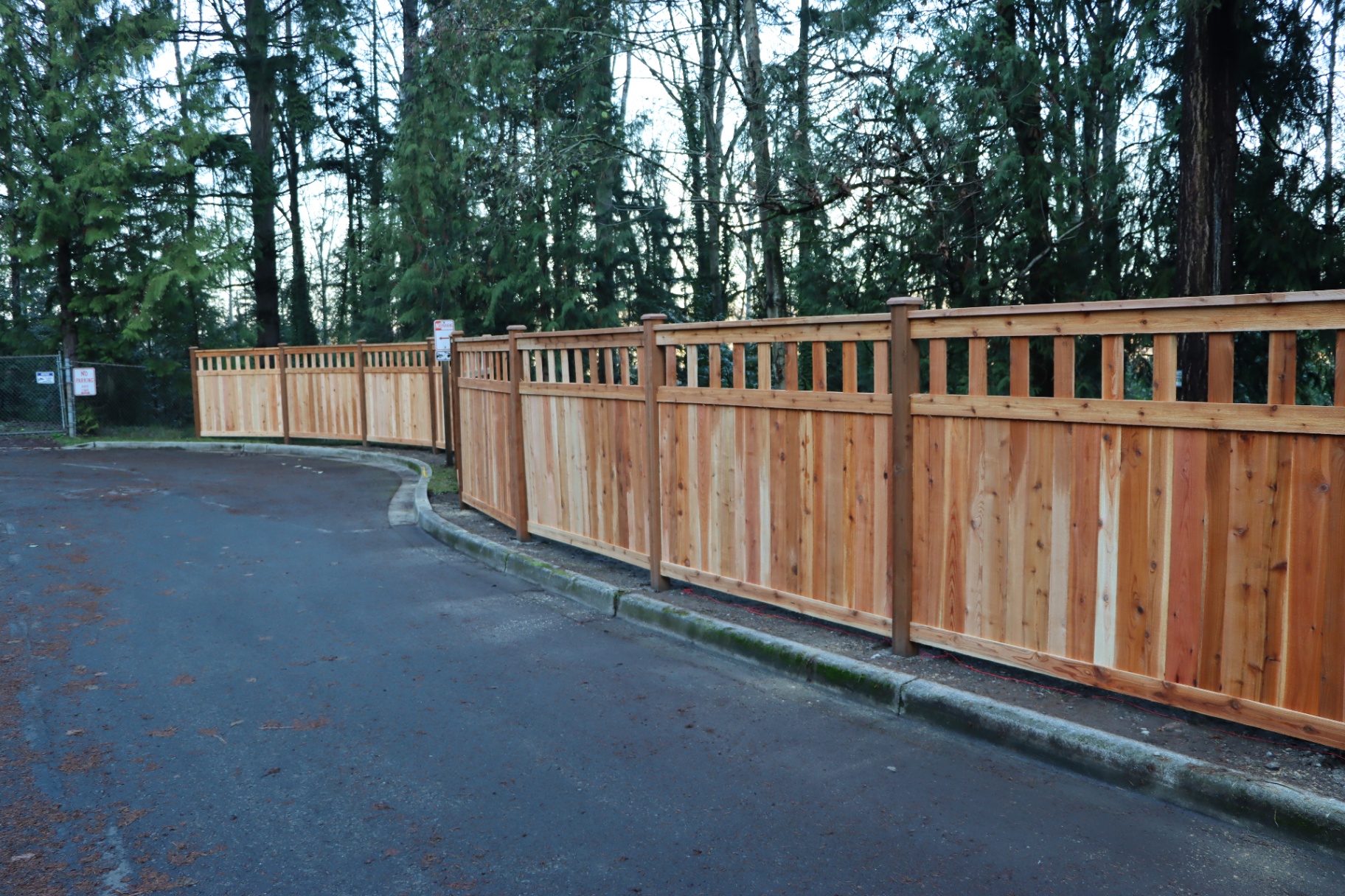 Straight run of craftsman fence showing alternating board pattern