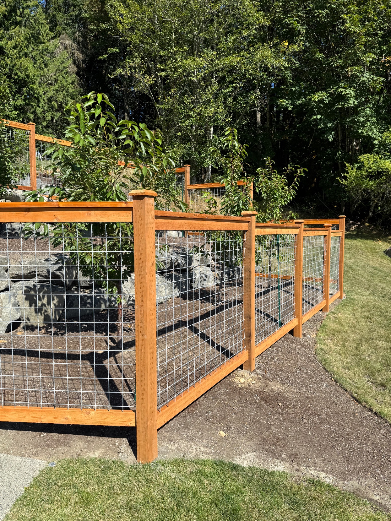 Galvanized hogwire fence panels showing wire mesh construction detail