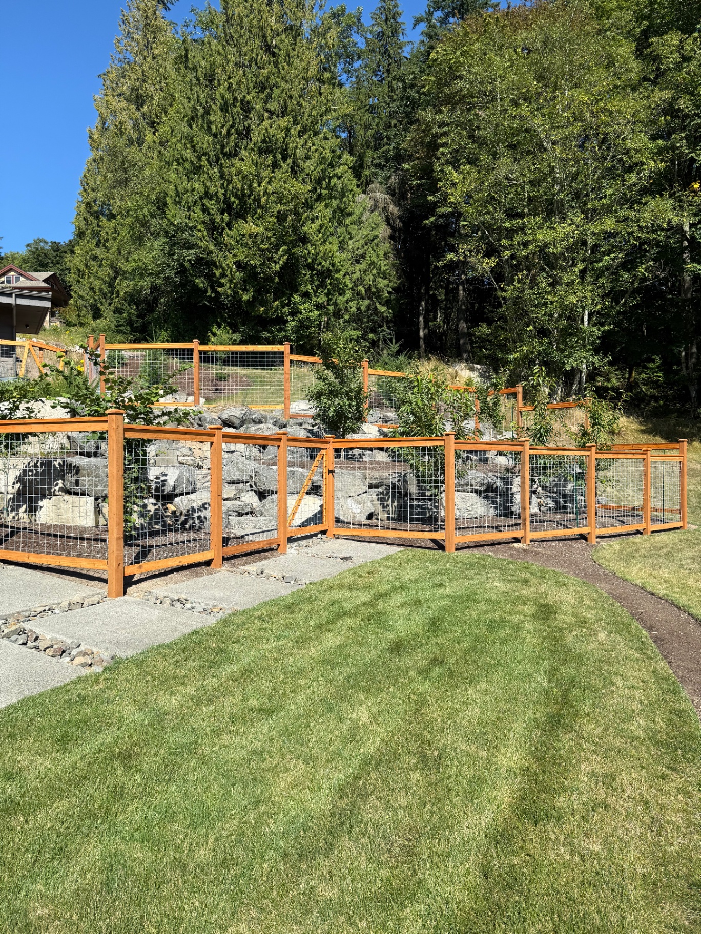 Galvanized hogwire fence with gate access and professional installation