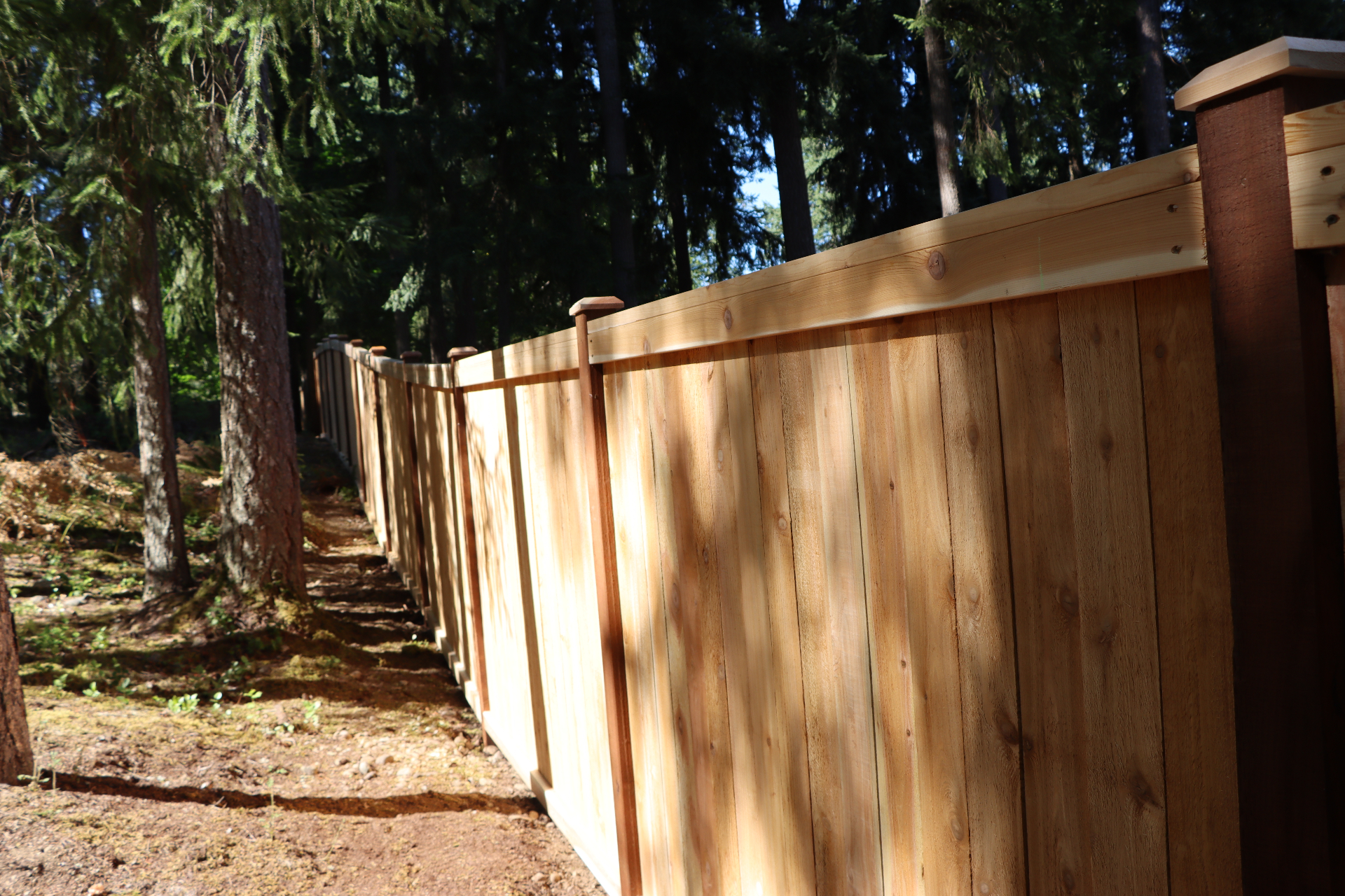 Wooded property picture frame fence showing cap and trim detail