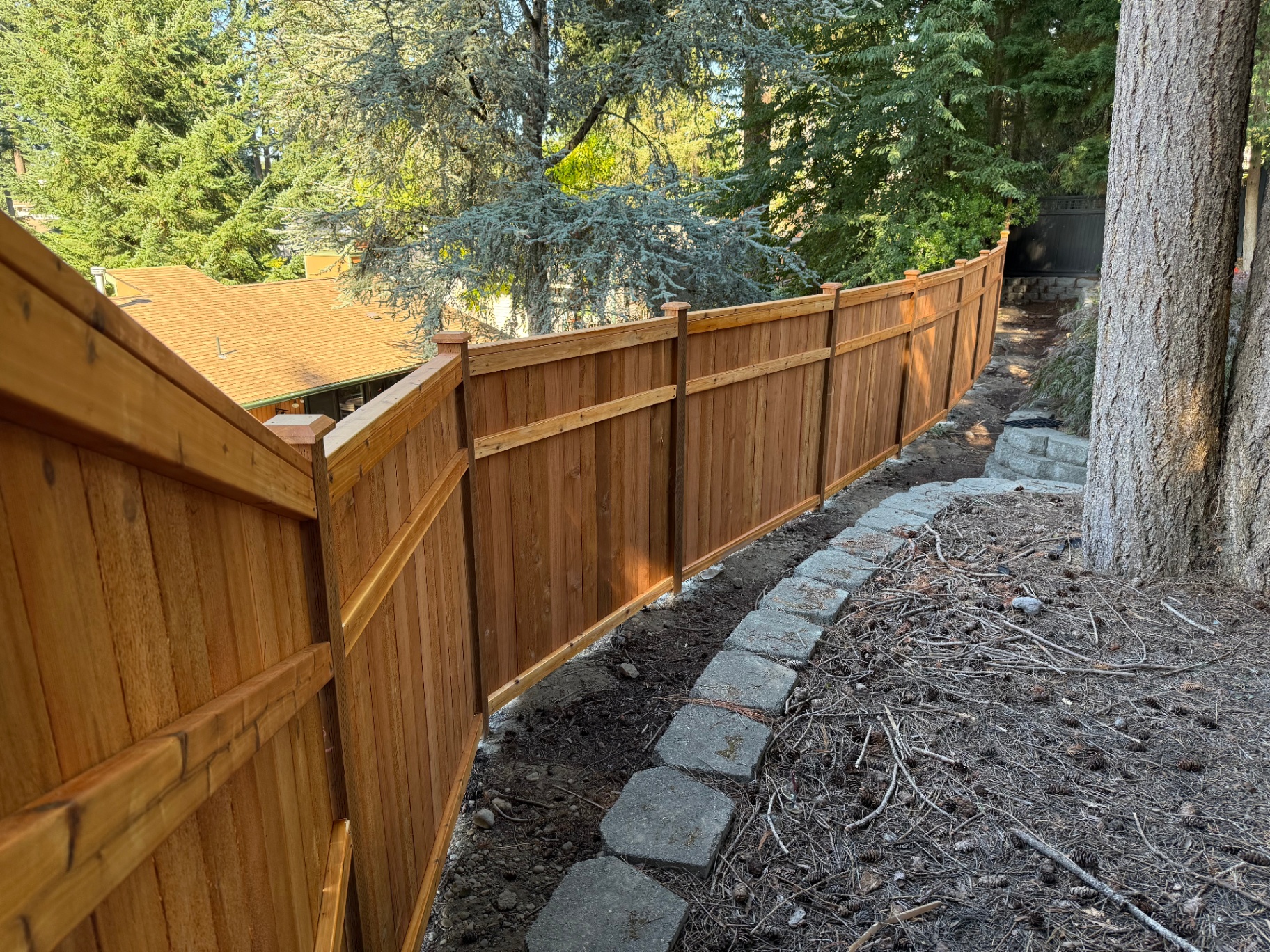 3 rail picture frame fence following terrain in Seattle