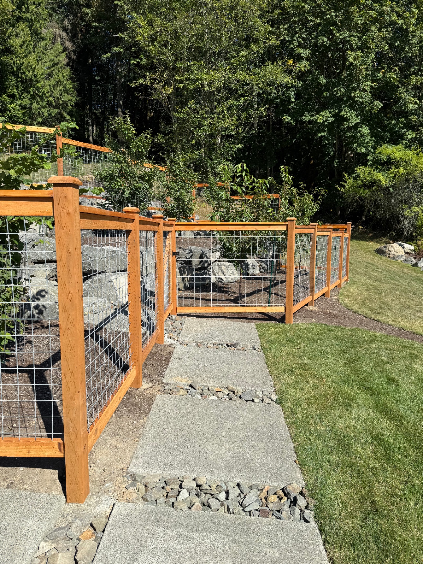 5' galvanized hogwire fence with gate installation in residential setting