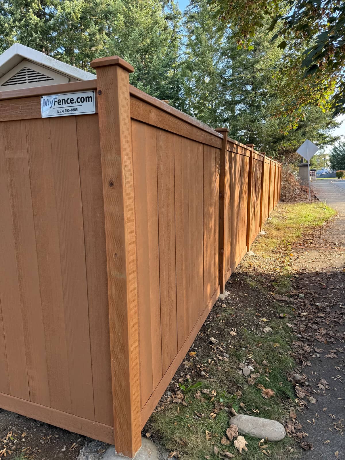 Rodda Manor stained cedar picture frame fence along a sidewalk in Maple Valley, WA