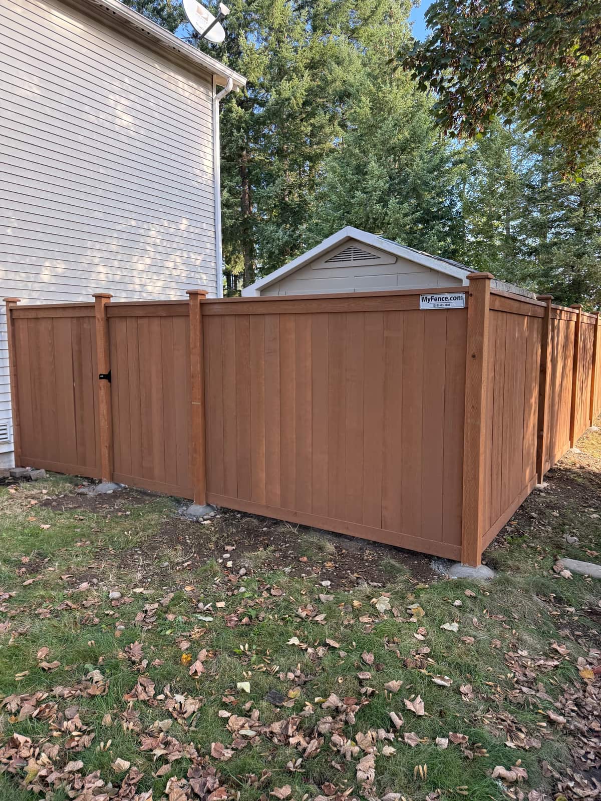 Rodda Manor stained cedar picture frame fence with a walk gate in Maple Valley, WA
